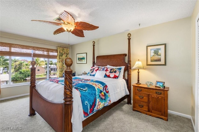 24398 Treasure Island Blvd, Punta Gorda, FL 33955 - bedroom with light carpet, a textured ceiling, and ceiling fan