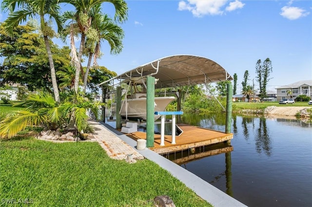 24398 Treasure Island Blvd, Punta Gorda, FL 33955 - dock with boat lift, a water view, and a yard
