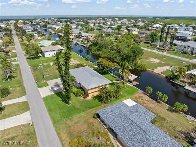 24398 Treasure Island Blvd, Punta Gorda, FL 33955 - aerial perspective of suburban area with a large body of water