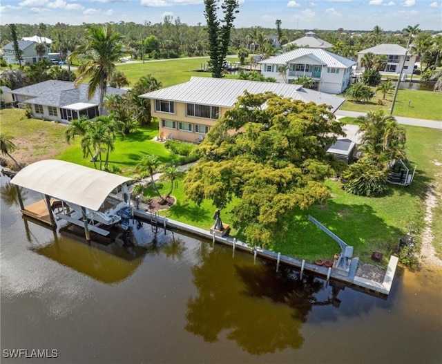 24398 Treasure Island Blvd, Punta Gorda, FL 33955 - dock featuring a water view, boat lift, a residential view, and view of scattered trees