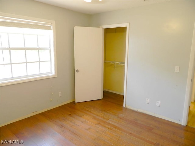 3611 8th Ave SE, Naples, FL 34117 - unfurnished bedroom featuring light wood finished floors