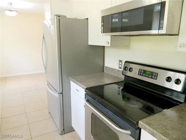 3611 8th Ave SE, Naples, FL 34117 - kitchen featuring stainless steel appliances, white cabinetry, and light tile patterned floors