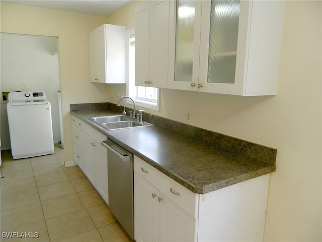 3611 8th Ave SE, Naples, FL 34117 - kitchen with washer / dryer, stainless steel dishwasher, white cabinetry, dark countertops, and glass insert cabinets