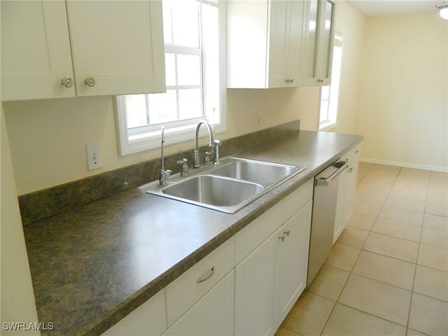 3611 8th Ave SE, Naples, FL 34117 - kitchen with white cabinets, stainless steel dishwasher, and light tile patterned floors