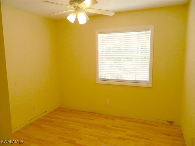 3611 8th Ave SE, Naples, FL 34117 - empty room featuring light wood finished floors and ceiling fan
