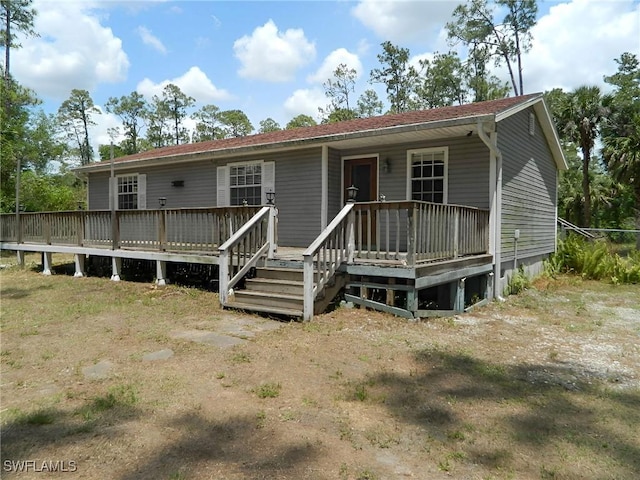 3611 8th Ave SE, Naples, FL 34117 - view of front of house featuring a wooden deck
