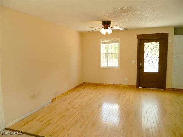 3611 8th Ave SE, Naples, FL 34117 - foyer entrance featuring a ceiling fan and light wood-style flooring