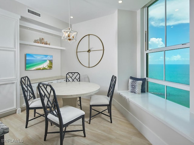960 Cape Marco Dr Unit 1901, Marco Island, FL 34145 - dining area with light wood-style floors, a wall of windows, a water view, and recessed lighting