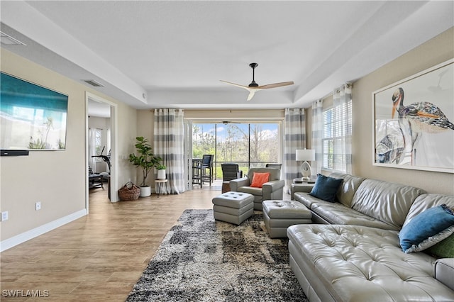 19671 Marino Lake Cir Unit 1602, Miromar Lakes, FL 33913 - living room featuring ceiling fan, light wood finished floors, and a raised ceiling