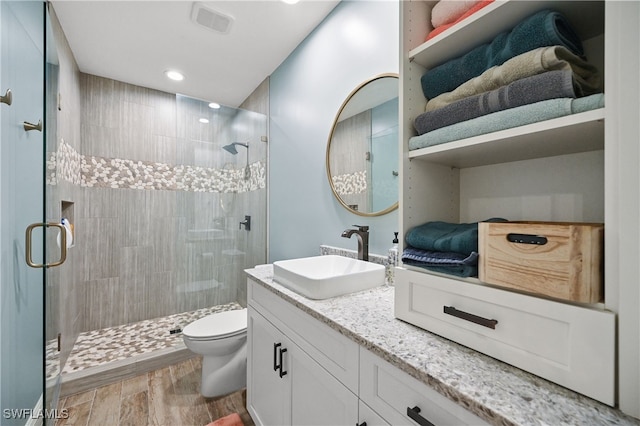 19671 Marino Lake Cir Unit 1602, Miromar Lakes, FL 33913 - full bath with a shower stall, wood finished floors, vanity, and recessed lighting