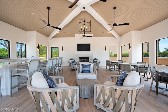 4875 Pelican Colony Blvd Unit 1801, Bonita Springs, FL 34134 - living room featuring ceiling fan, high vaulted ceiling, a wooden ceiling with exposed beams, healthy amount of natural light, and a fireplace