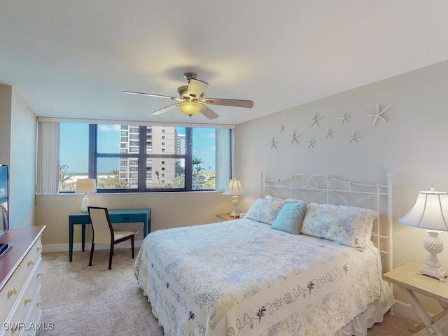 58 N Collier Blvd Unit 404, Marco Island, FL 34145 - bedroom featuring multiple windows, light colored carpet, and ceiling fan