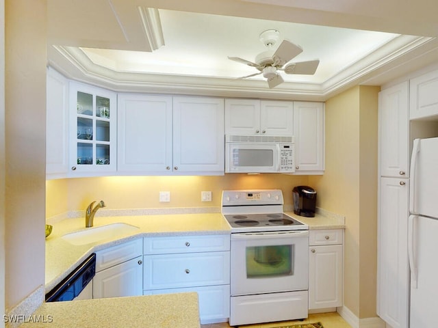 58 N Collier Blvd Unit 404, Marco Island, FL 34145 - kitchen featuring white appliances, white cabinetry, and light countertops