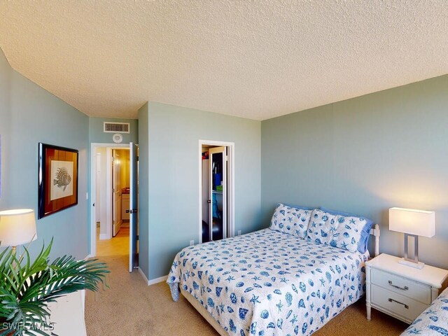 58 N Collier Blvd Unit 404, Marco Island, FL 34145 - bedroom with light colored carpet and a textured ceiling