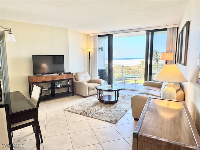 58 N Collier Blvd Unit 404, Marco Island, FL 34145 - tiled living room featuring floor to ceiling windows