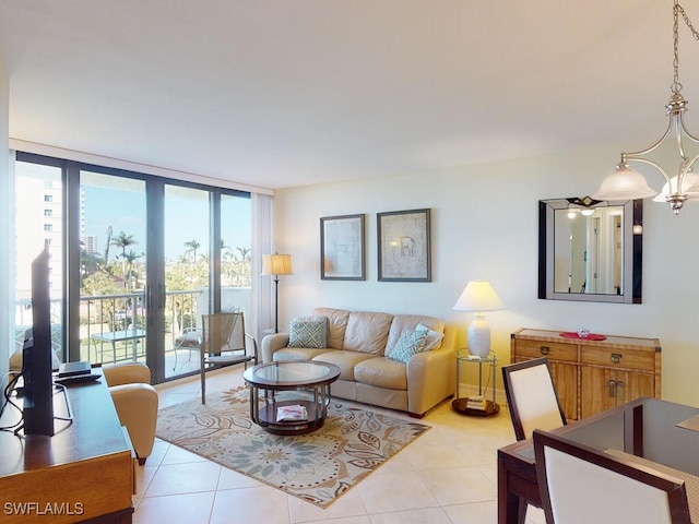 58 N Collier Blvd Unit 404, Marco Island, FL 34145 - living area featuring a chandelier, light tile patterned flooring, and expansive windows
