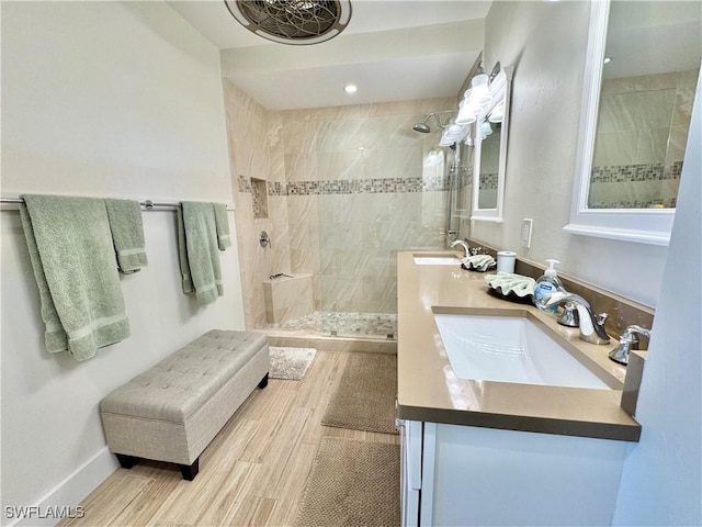58 N Collier Blvd Unit 404, Marco Island, FL 34145 - full bath with a walk in shower, double vanity, and wood finished floors