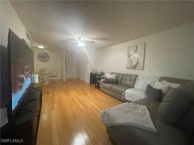 3706 Broadway Unit 27, Fort Myers, FL 33901 - living room with light wood-style floors and ceiling fan