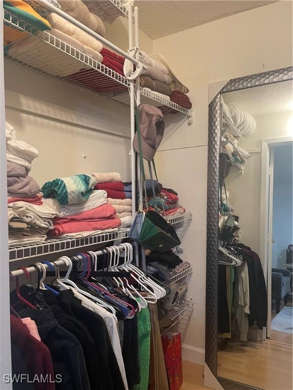 3706 Broadway Unit 27, Fort Myers, FL 33901 - spacious closet featuring wood finished floors