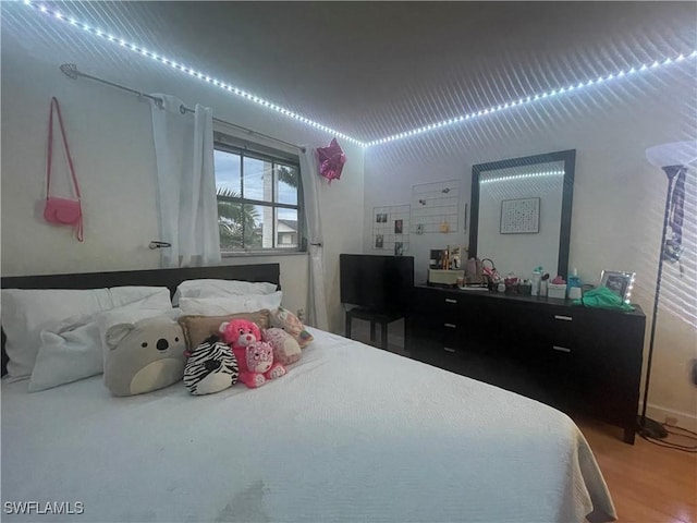 3706 Broadway Unit 27, Fort Myers, FL 33901 - bedroom featuring wood finished floors