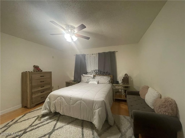 3706 Broadway Unit 27, Fort Myers, FL 33901 - bedroom featuring wood finished floors, a ceiling fan, and a textured ceiling