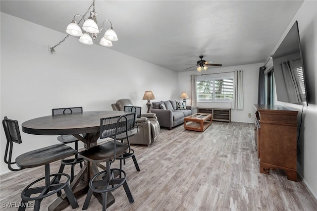 11140 Caravel Cir Unit 306, Fort Myers, FL 33908 - dining area with ceiling fan, light wood-style floors, and a chandelier
