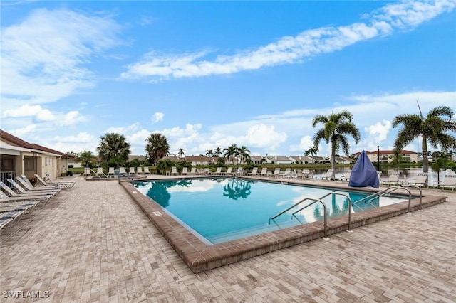 11140 Caravel Cir Unit 306, Fort Myers, FL 33908 - community pool featuring a patio