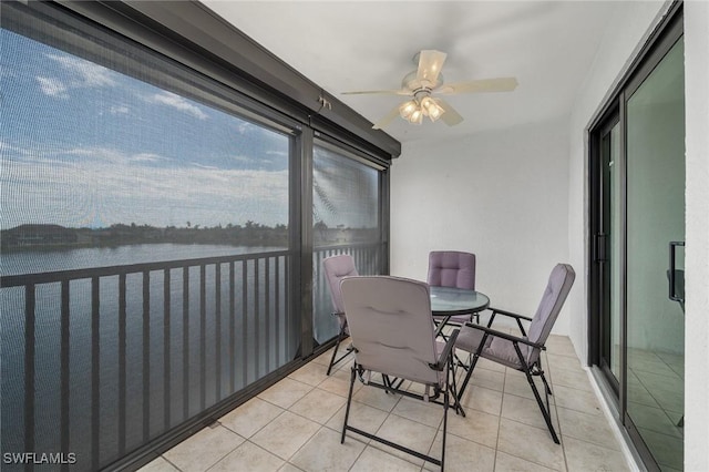 11140 Caravel Cir Unit 306, Fort Myers, FL 33908 - sunroom featuring ceiling fan, outdoor dining area, and a water view