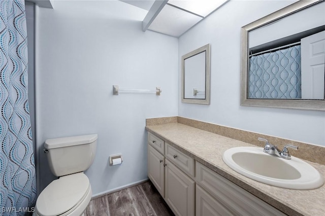 11140 Caravel Cir Unit 306, Fort Myers, FL 33908 - bathroom featuring wood finished floors, vanity, and a shower with shower curtain