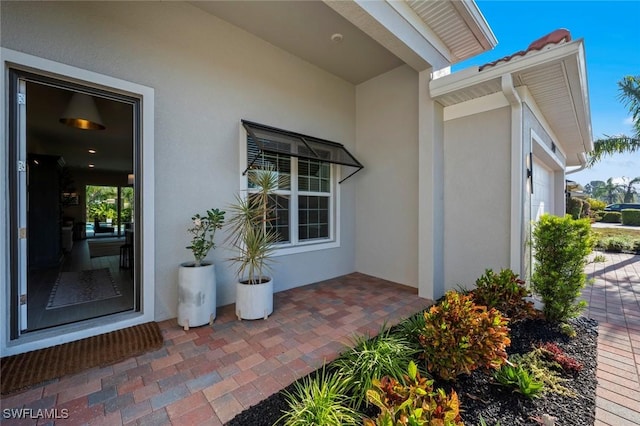 10581 Woodchuck Ln, Bonita Springs, FL 34135 - doorway to property featuring stucco siding