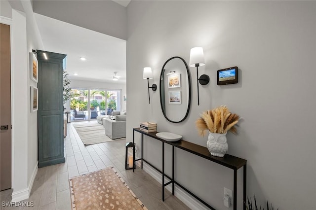 10581 Woodchuck Ln, Bonita Springs, FL 34135 - hall with recessed lighting and wood tiled floors