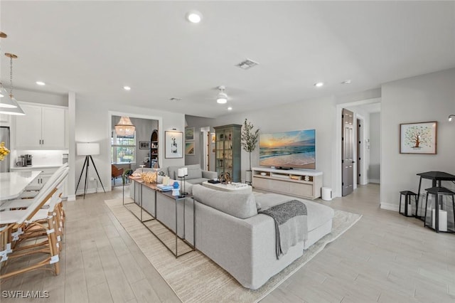 10581 Woodchuck Ln, Bonita Springs, FL 34135 - living room with recessed lighting and light wood finished floors