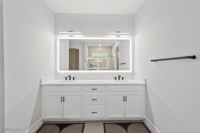 10581 Woodchuck Ln, Bonita Springs, FL 34135 - bathroom featuring double vanity and a shower with shower door