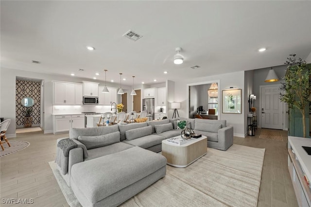 10581 Woodchuck Ln, Bonita Springs, FL 34135 - living room with light wood-type flooring and recessed lighting