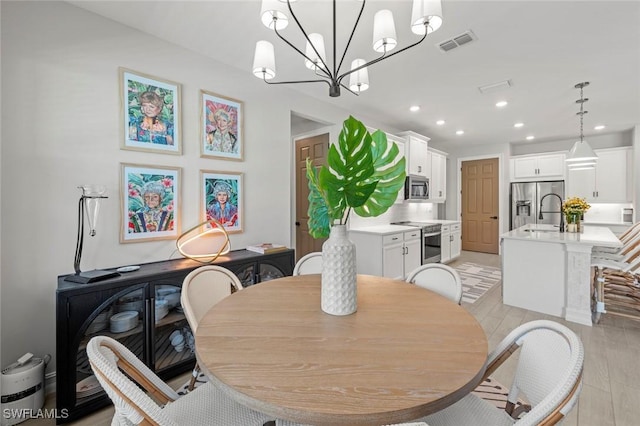 10581 Woodchuck Ln, Bonita Springs, FL 34135 - dining area with recessed lighting and a chandelier