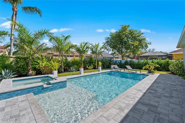 10581 Woodchuck Ln, Bonita Springs, FL 34135 - view of pool with a pool with connected hot tub, a patio area, and a fenced backyard
