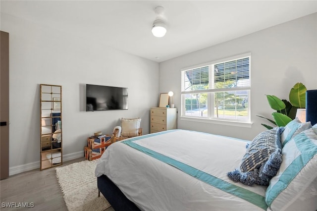 10581 Woodchuck Ln, Bonita Springs, FL 34135 - bedroom with wood finished floors and baseboards