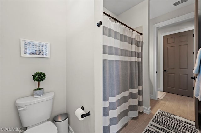 10581 Woodchuck Ln, Bonita Springs, FL 34135 - full bath with wood finished floors and a shower with curtain
