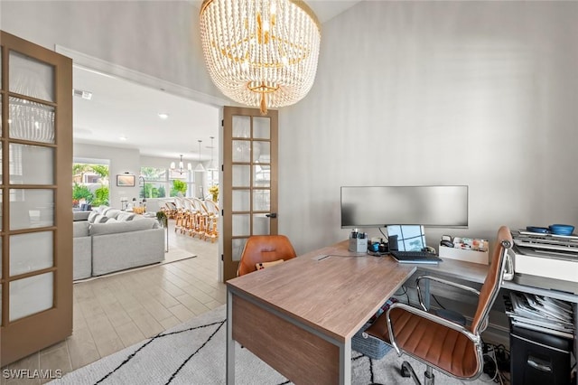 10581 Woodchuck Ln, Bonita Springs, FL 34135 - office area with a chandelier, wood finished floors, and french doors