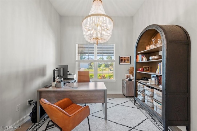 10581 Woodchuck Ln, Bonita Springs, FL 34135 - office area featuring a chandelier and light colored carpet