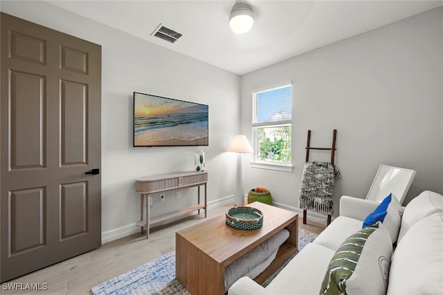10581 Woodchuck Ln, Bonita Springs, FL 34135 - living area featuring baseboards and light wood-style floors