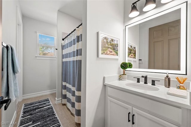 10581 Woodchuck Ln, Bonita Springs, FL 34135 - full bathroom featuring vanity, curtained shower, and wood finished floors