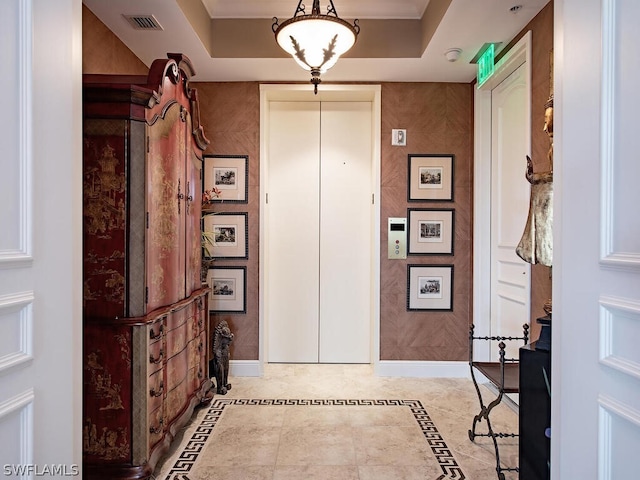 5051 Pelican Colony Blvd Unit 401, Bonita Springs, FL 34134 - hall featuring inlaid floor details, elevator, and a raised ceiling