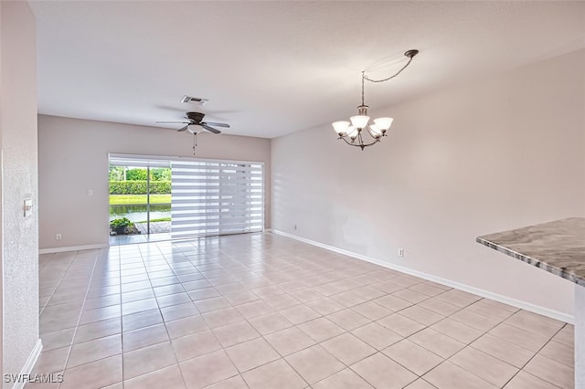 10058 Pacific Pines Ave, Fort Myers, FL 33966 - unfurnished room with a chandelier, light tile patterned flooring, and ceiling fan