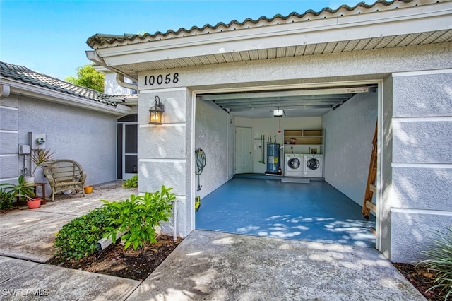 10058 Pacific Pines Ave, Fort Myers, FL 33966 - garage with washing machine and dryer and electric water heater