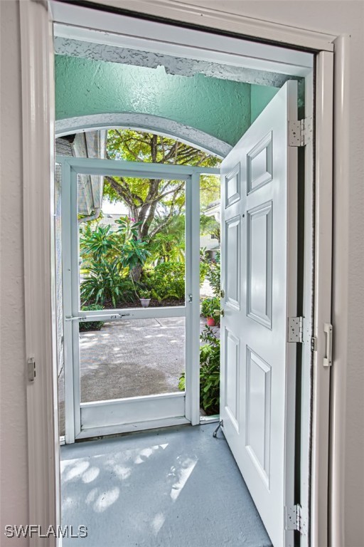10058 Pacific Pines Ave, Fort Myers, FL 33966 - doorway featuring concrete floors