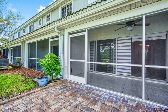10058 Pacific Pines Ave, Fort Myers, FL 33966 - view of property exterior featuring a sunroom and a ceiling fan