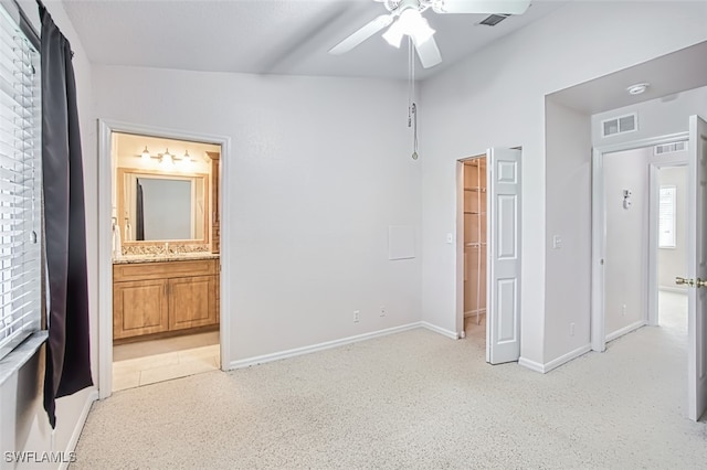 10058 Pacific Pines Ave, Fort Myers, FL 33966 - unfurnished bedroom featuring ensuite bathroom, a walk in closet, and ceiling fan