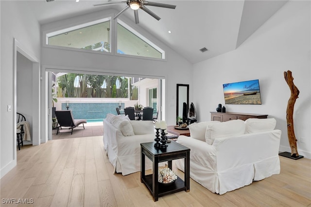 2120 Curtis St, Naples, FL 34112 - living area featuring high vaulted ceiling, a ceiling fan, and light wood-type flooring