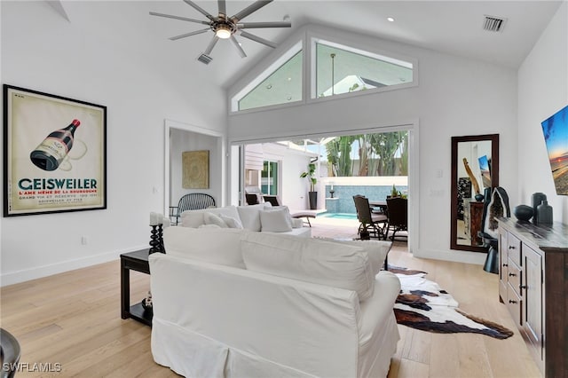 2120 Curtis St, Naples, FL 34112 - living area featuring high vaulted ceiling, ceiling fan, and light wood finished floors